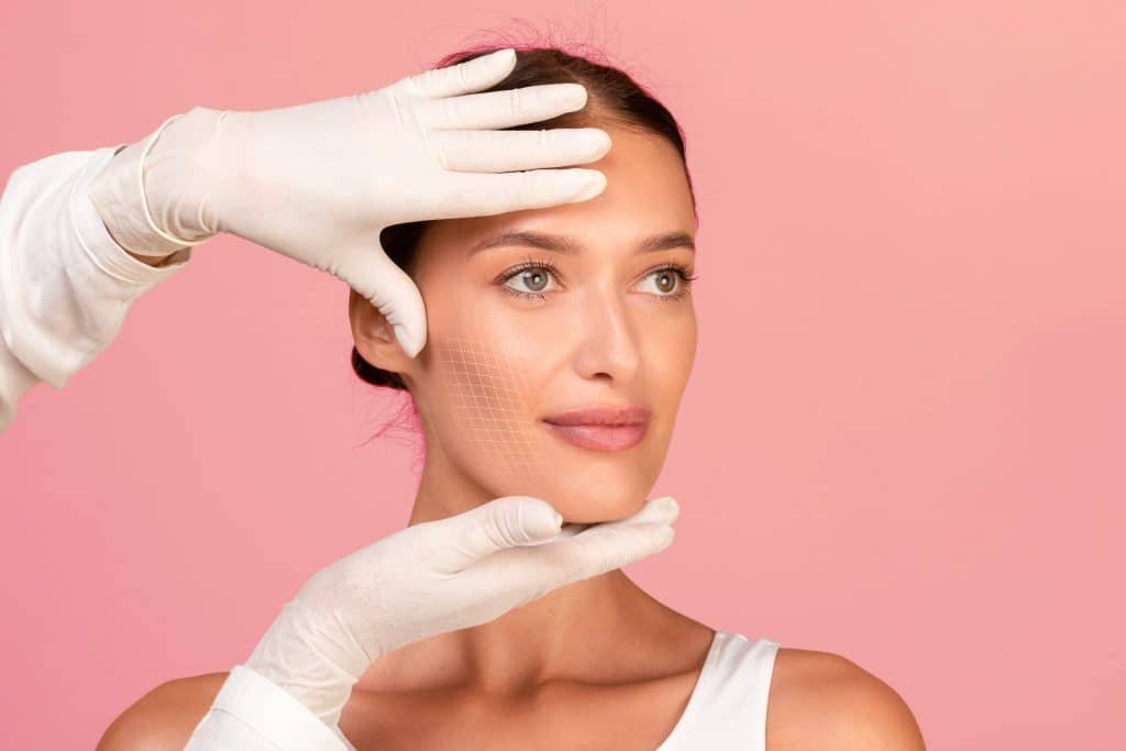 Woman's face being evaluated by plastic surgeon for a facelift in Newport Beach, CA