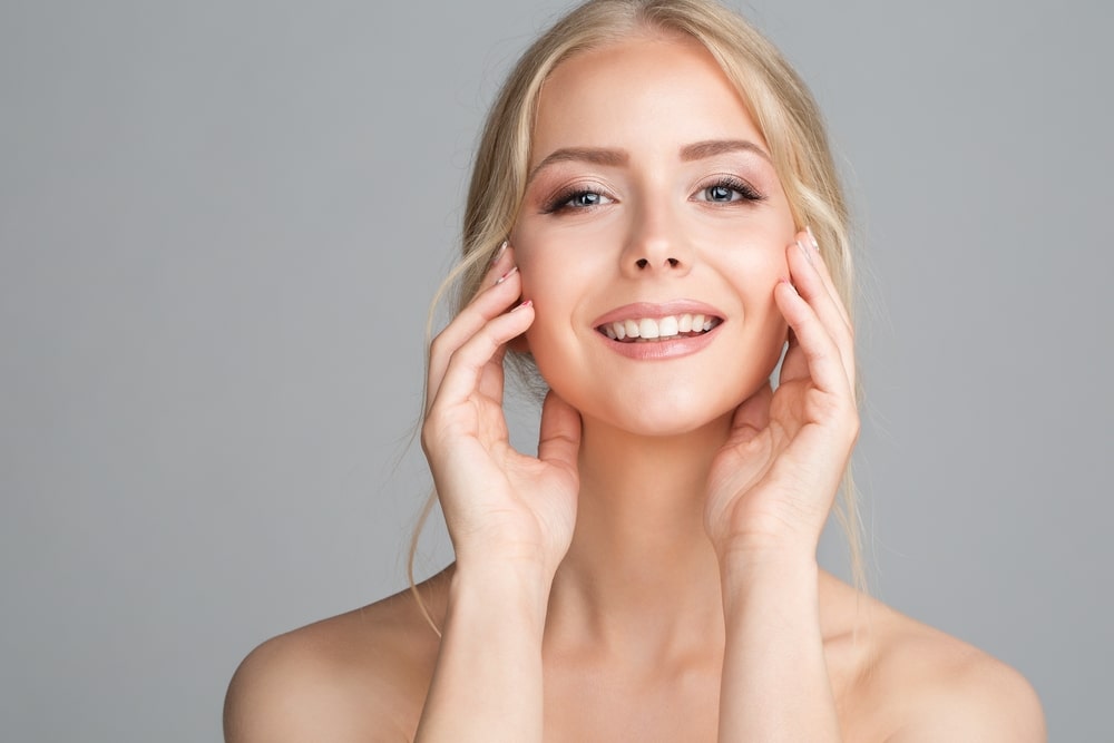Beautiful woman smiling after getting a facelift in Newport Beach, CA Beautiful woman smiling after getting a facelift in Newport Beach, CA