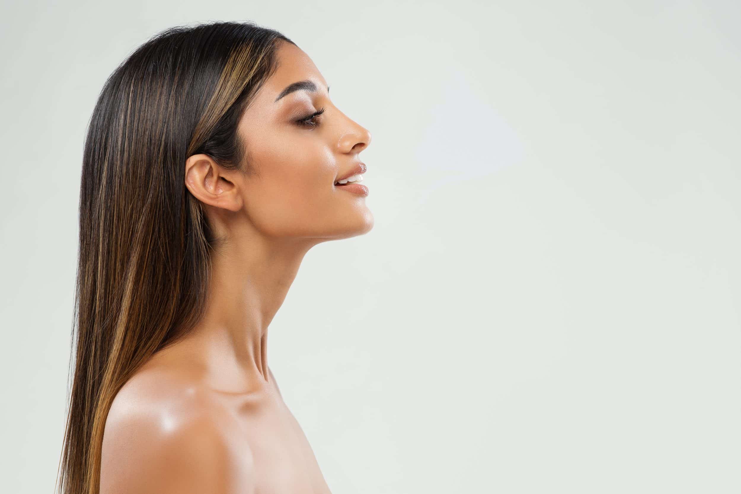 Side profile of woman after a nose procedure in Newport Beach, CA
